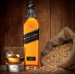 image of Jonnie Walker Black Label and a glass of Whiskey, with grain, Ross vincent product photography commissioned by Chosen.