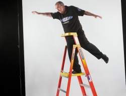 Phil taylor dropping dart from the top of a werner ladder