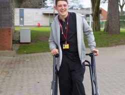 QED School pupil smiling having portrait taken