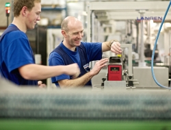Packaging machine workers discuss production-Industrial photos