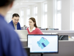 white modern office in czech republic with male and female workers-Industrial images by ross vincent