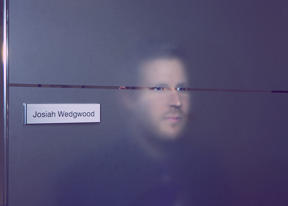 man looking through frosted glass, subject Nick pain at Price Waterhouse Coopers, part of a documentary project for Birmingham Colmore District and Birmingham City University