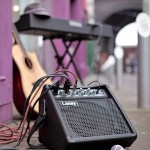 image of a portable guitar amplifier at the Custard factory Birmingham set up for busking with guitar and keyboard