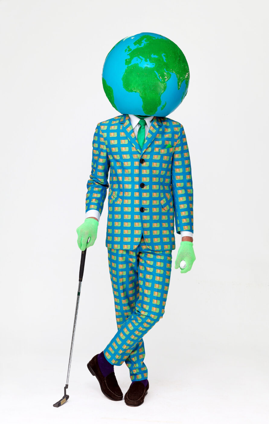 Lycamobile mascot man with a world globe on his head and golf club and ball in hands Publicity image by Ross Vincent Photography