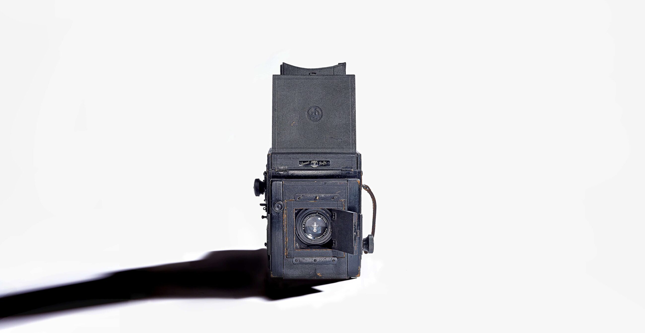 vintage camera with long shadow studio product photography by Ross Vincent-Birmingham