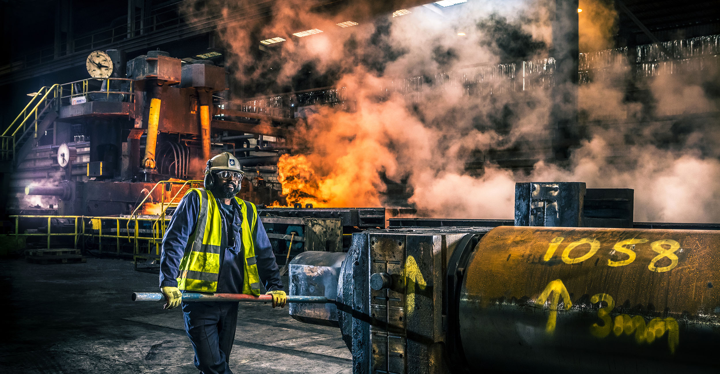 Worker in front of Hot rolled steel production line at Liberty Steel Newport