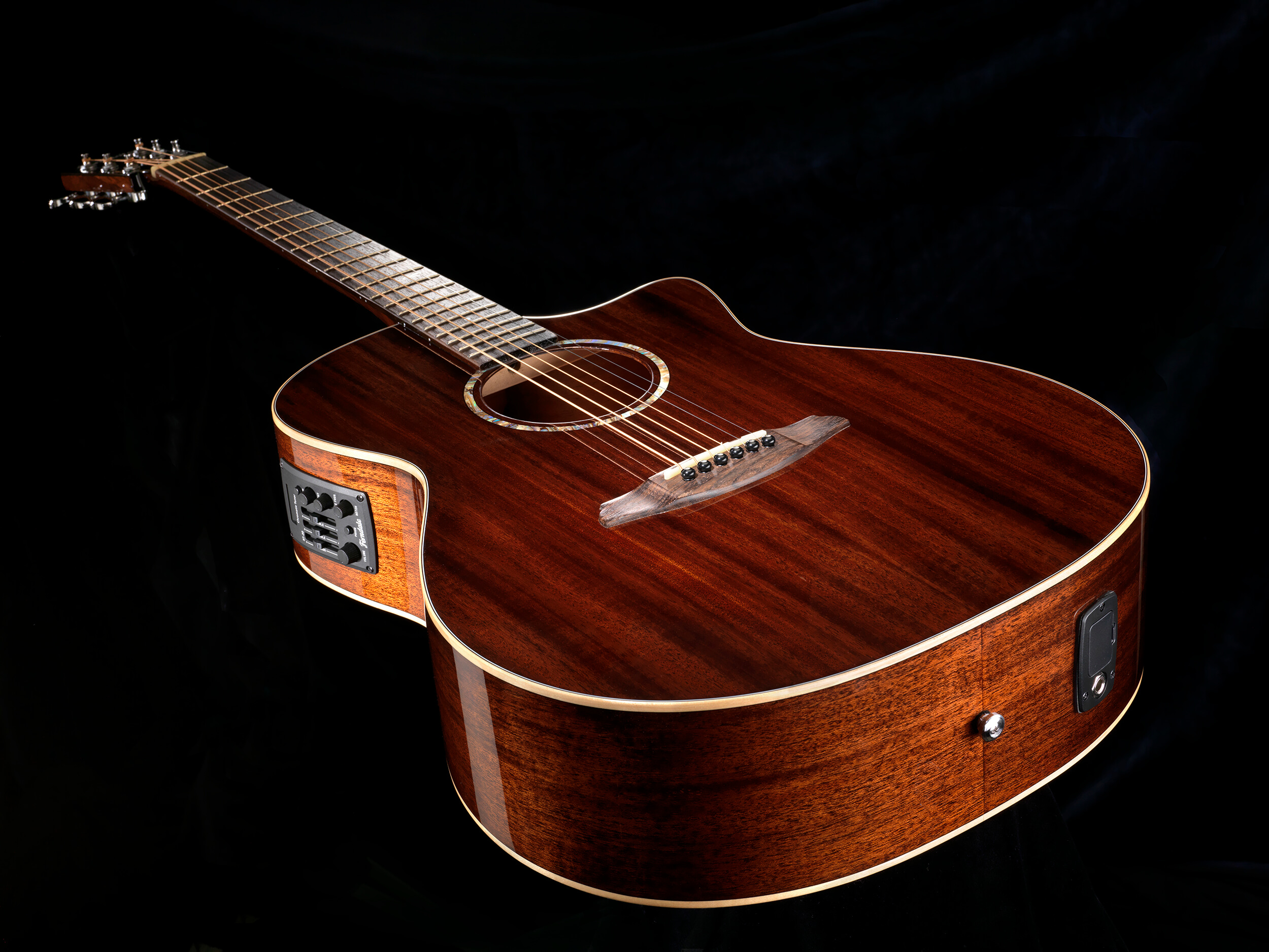 Photographic still life of a electric acoustic guitar for PMT music