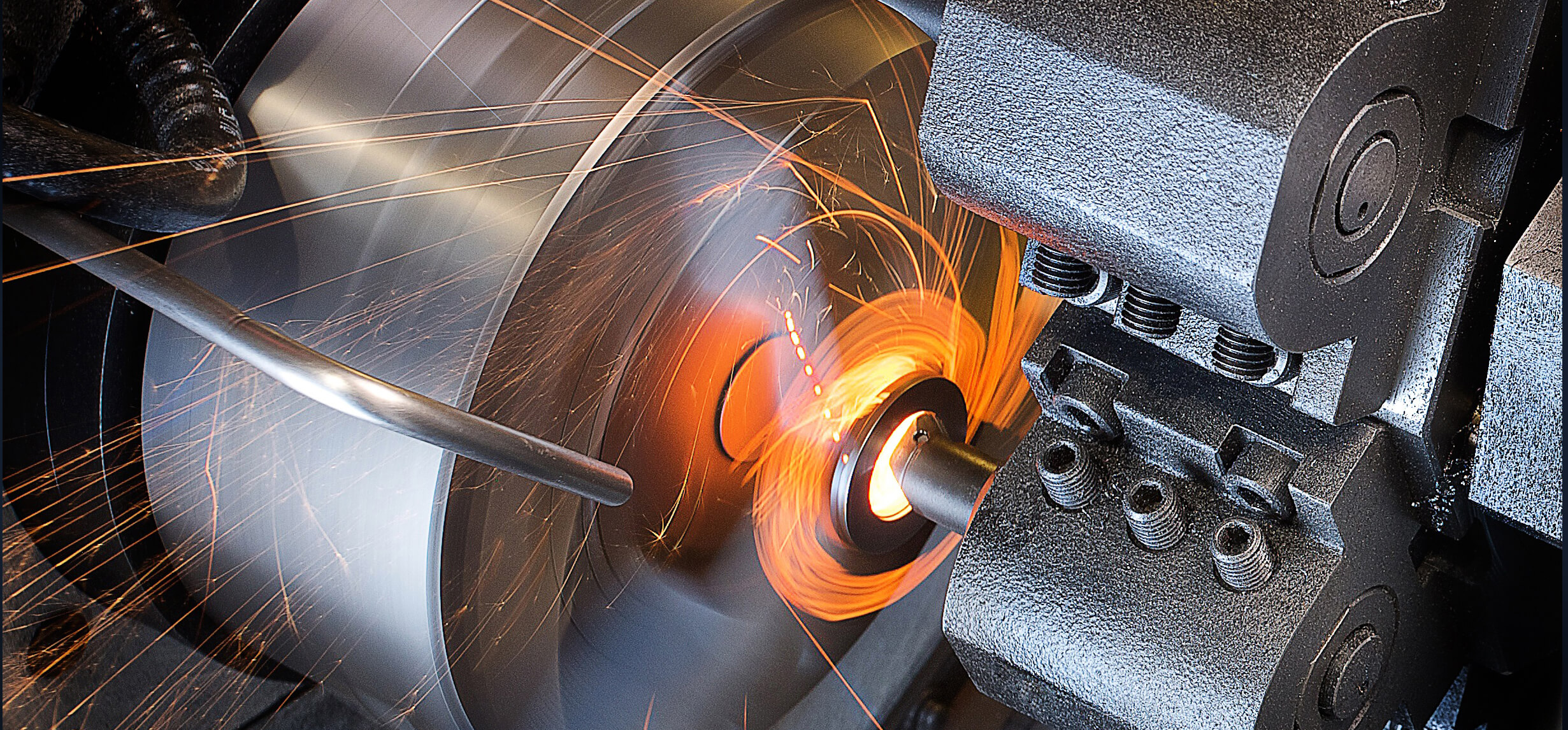 Machine turning with glowing sparks and light trails