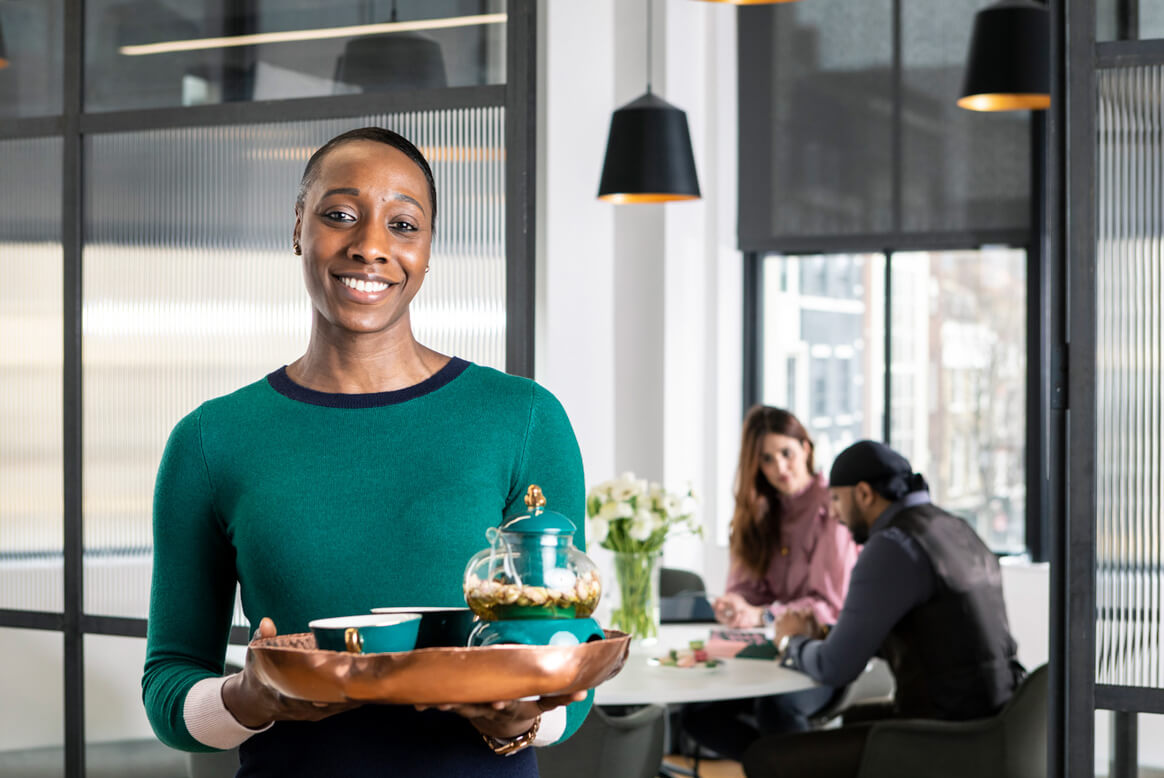 concierge office support in the heart of London, assistant offering drinks in stylish offices