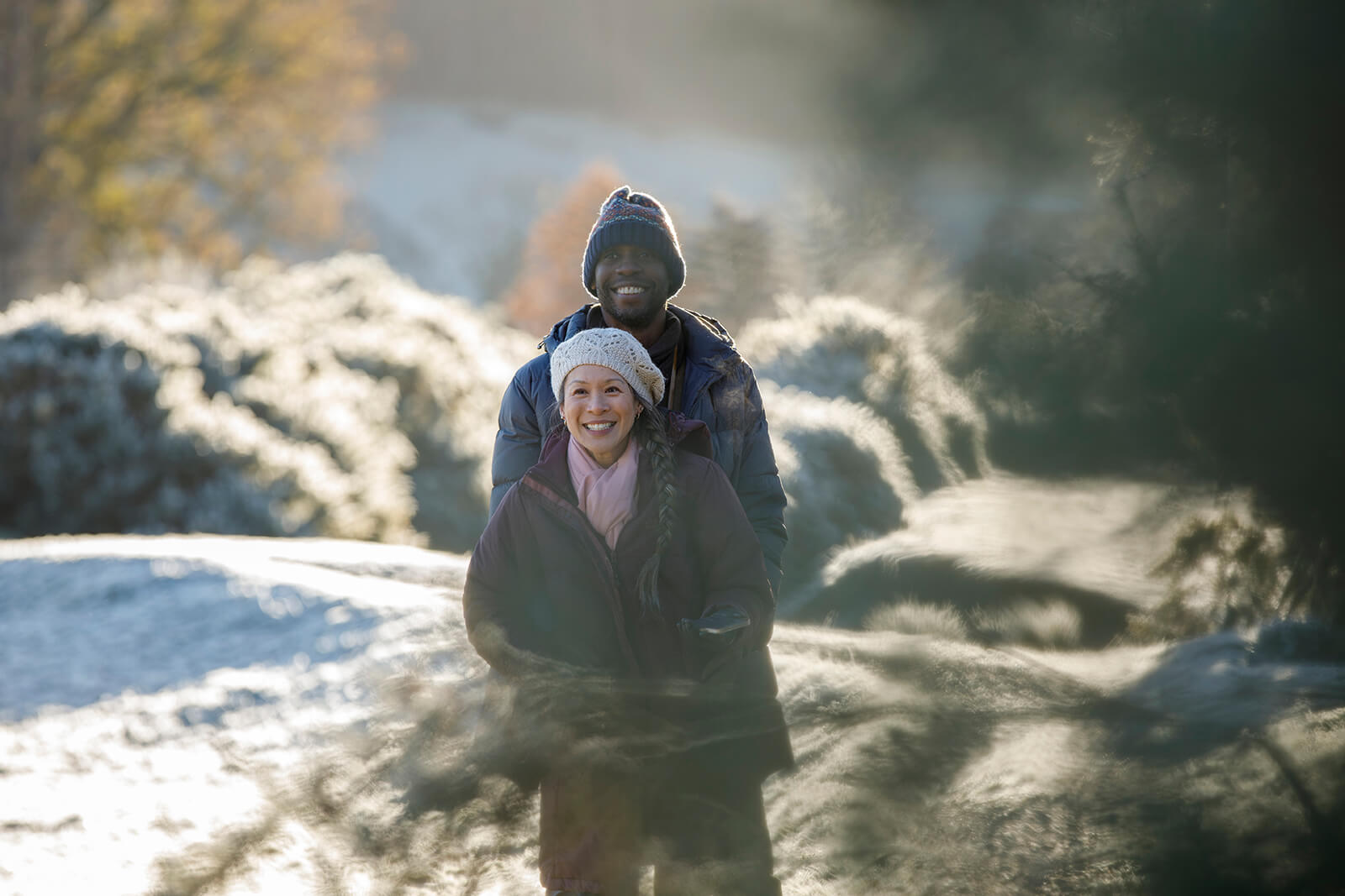 A couple enjoying winter walks at Braithwaite Village Caravanning site, Kendal in the lake District in the glorious sun